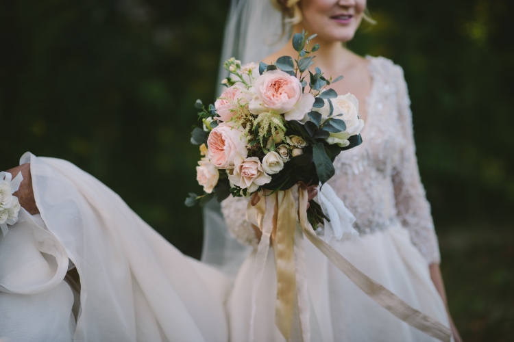 Close up of bride holding flower boquet